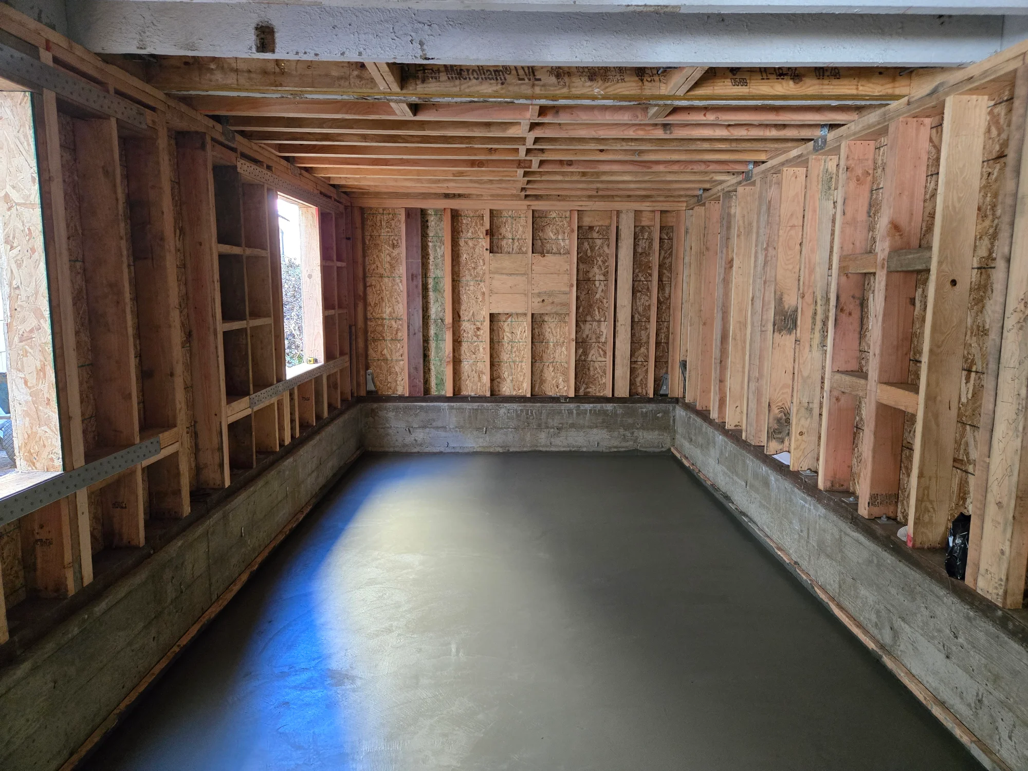 Interior framing with a new stair opening cut through the floor structure